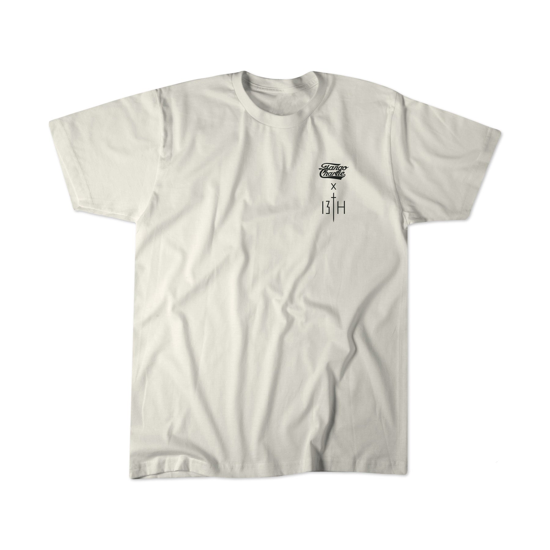 The Tango Charlie Apparel Lift Heavy. Pray Hard. tee is a plain white shirt with a small black graphic, stylized writing, and XIII, plus a subtle Lift Heavy message, displayed flat on a white background.