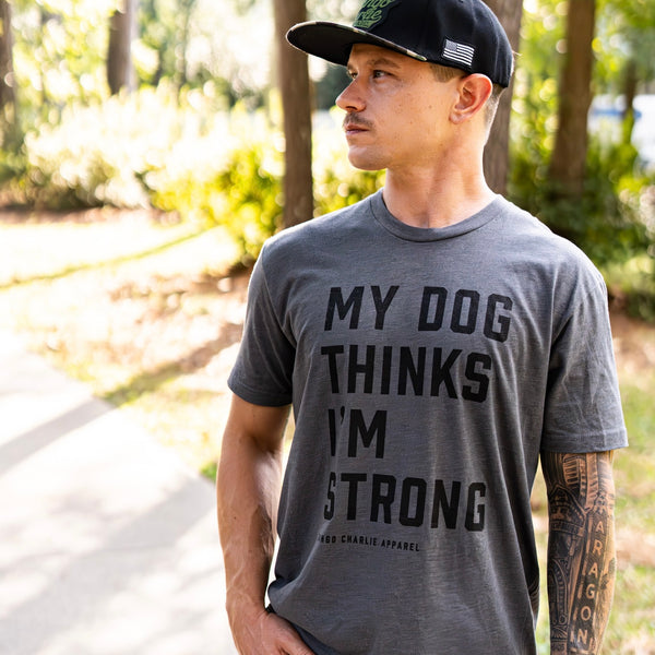 tango charlie - men's my dog thinks i'm strong tee on model