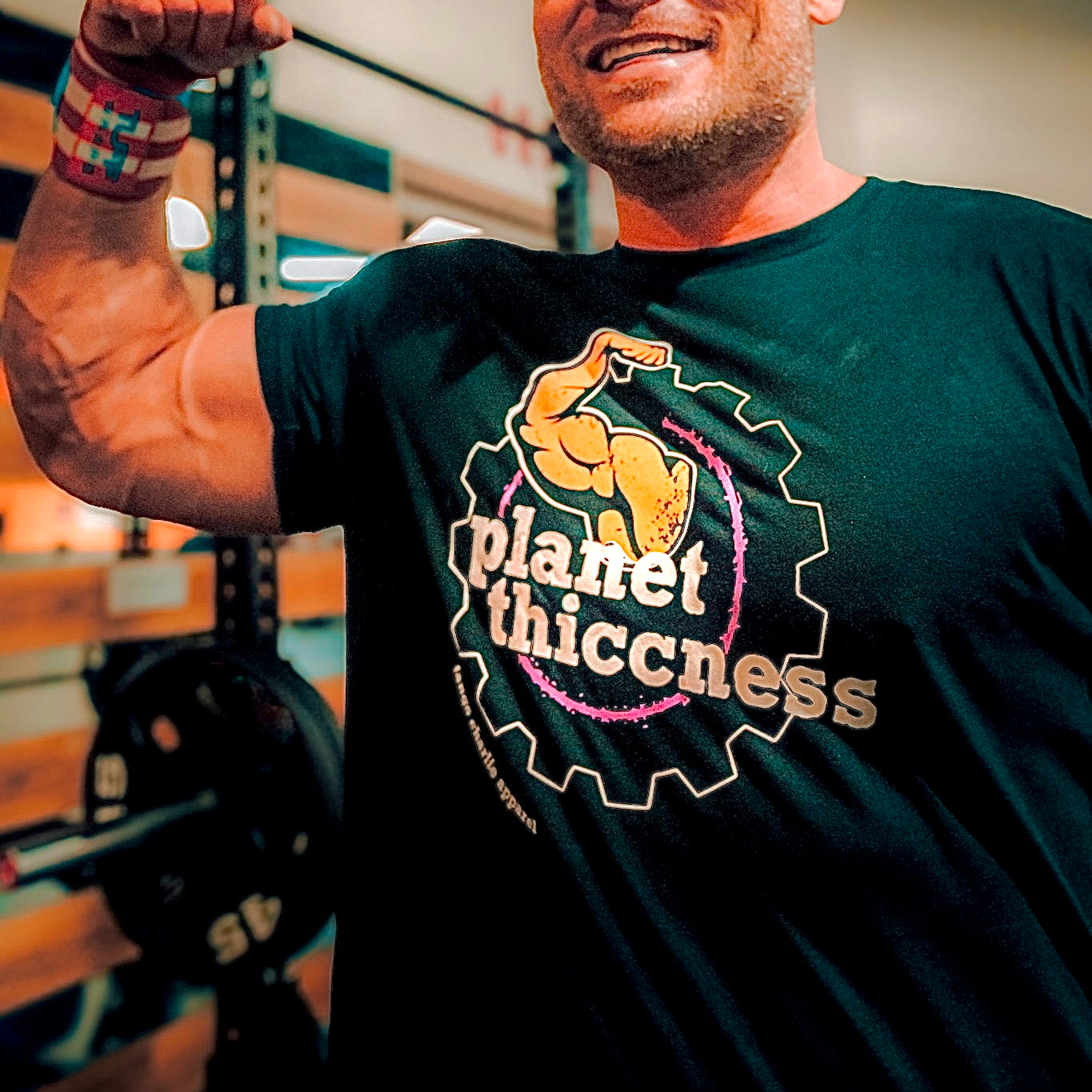 tango charlie - planet thiccness black t-shirt on model