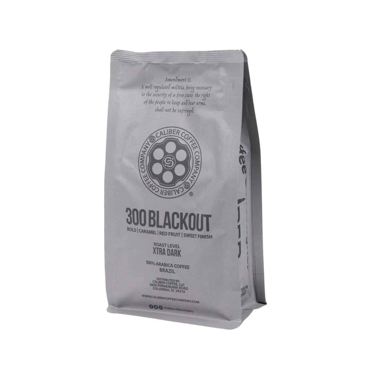 A gray coffee bag from Caliber Coffee Company, labeled Caliber Dark Roast 300 Blackout - Ground, features bold caramel and red fruit notes with a sweet finish. This XTRA dark roast is specialty grade coffee made from 100% single-origin Arabica beans sourced from Brazil, South America.