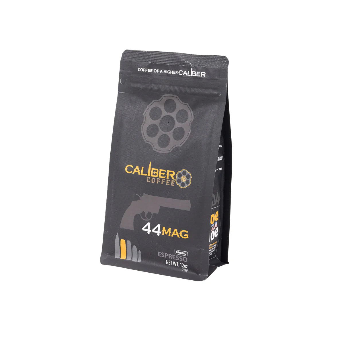 A 12 oz black bag of Caliber Espresso Roast .44 Mag by Caliber Coffee Company features 44 MAG in yellow and orange with a revolver cylinder and pistol graphic. Tagline: Coffee of a Higher Caliber. Made from 100% Arabica beans.