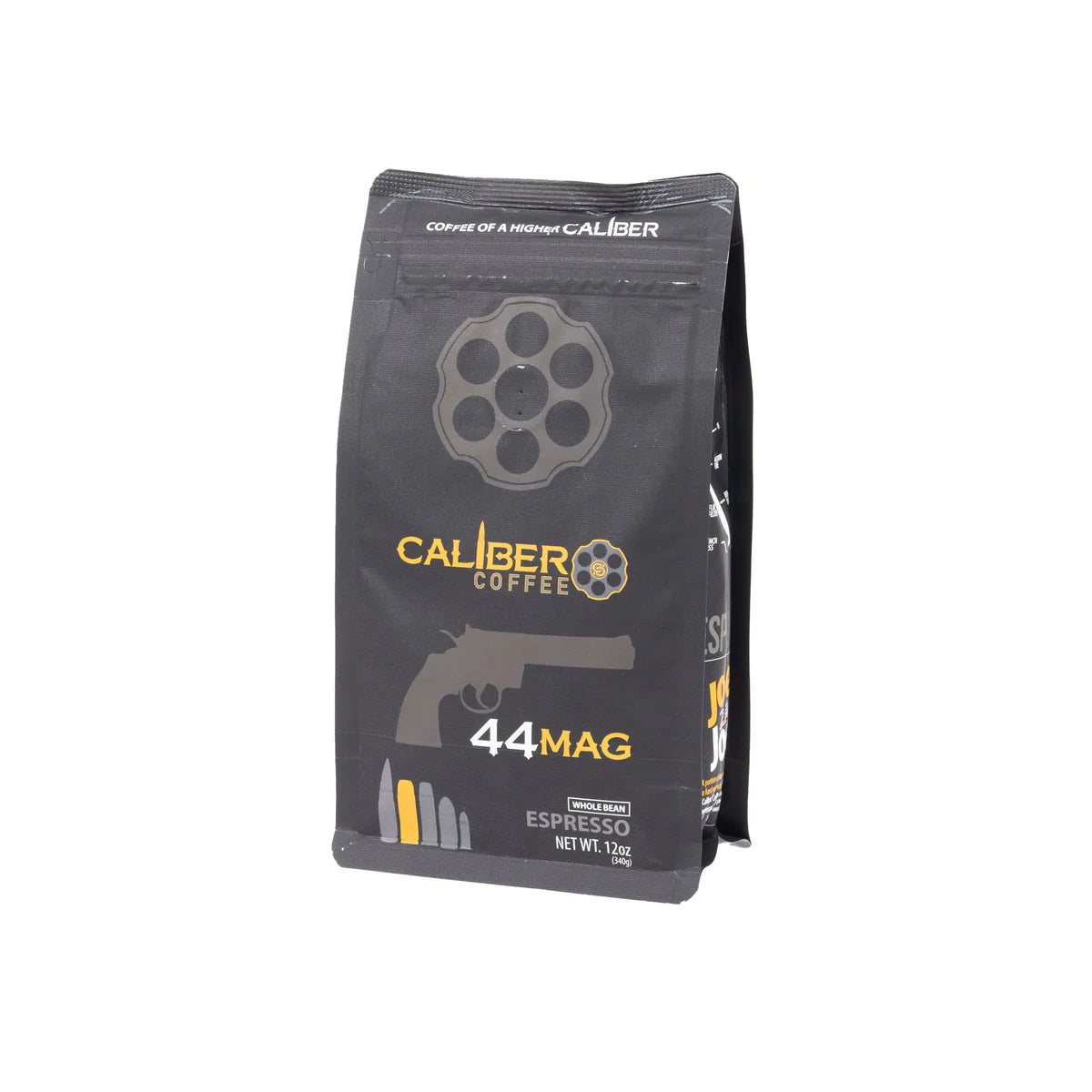 A black package of Caliber Coffee Company features gun-themed graphics, including a revolver chamber and handgun silhouette. The label on Caliber Espresso Roast .44 Mag - Whole Bean displays a net weight of 12 oz, highlighting artisan roasted, 100% Arabica beans for specialty grade coffee lovers.
