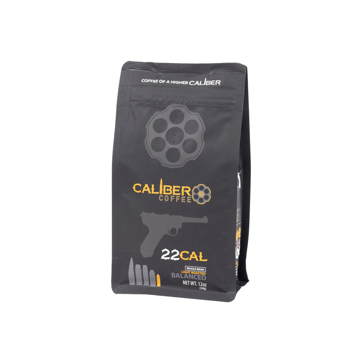 A 12 oz black package of Caliber Coffee Companys Light Roast .22 Cal showcases a revolver cylinder and handgun graphic with the text Coffee of a Higher Caliber and Caliber Light Roast. This specialty grade, medium roast promises an exceptional coffee experience.