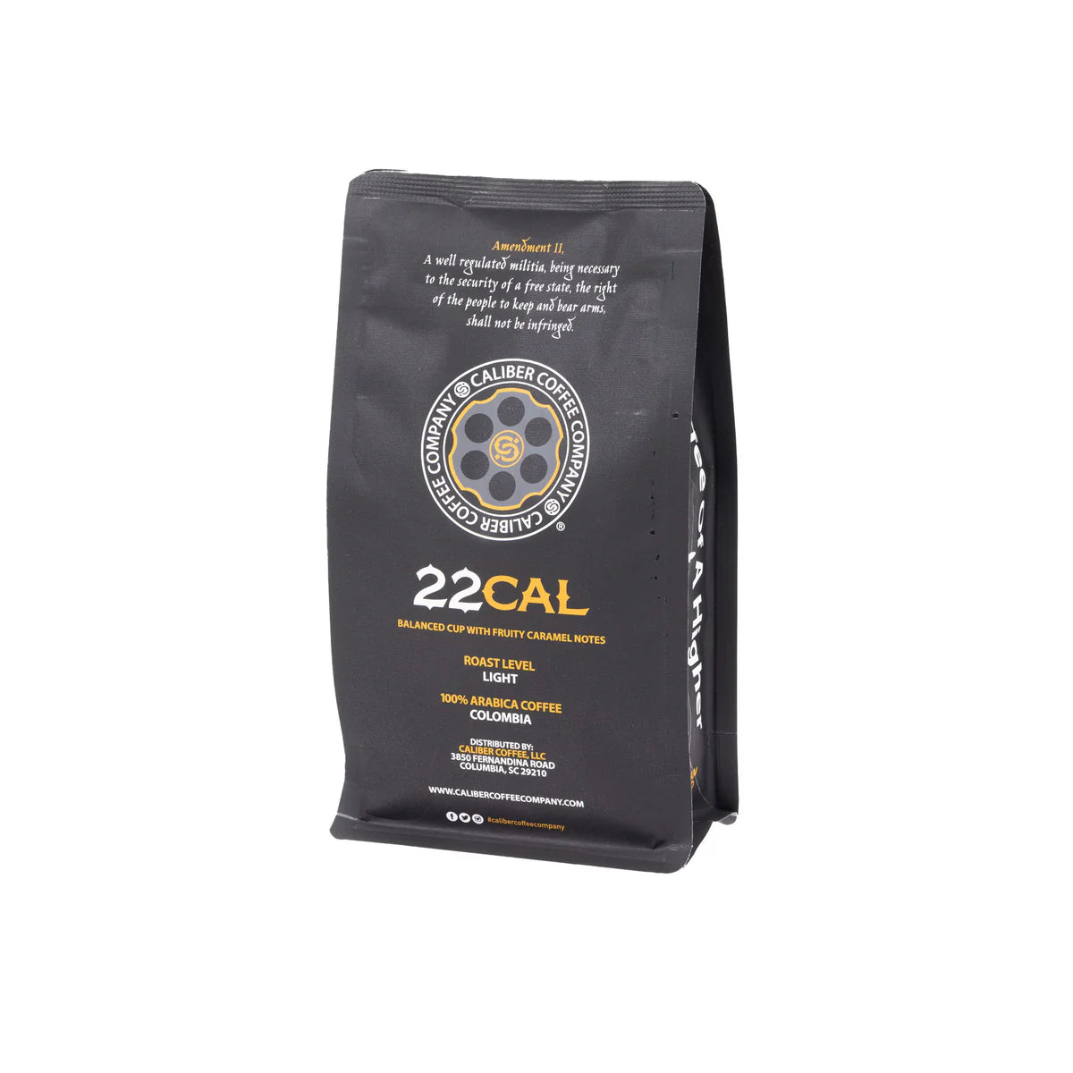 A black package of Caliber Light Roast .22 Cal - Ground by Caliber Coffee Company features a circular logo with a coffee cup and gun barrel design. The label describes it as a lightly roasted, specialty grade, 100% Arabica coffee from Colombia with Balanced cup with fruity caramel notes.