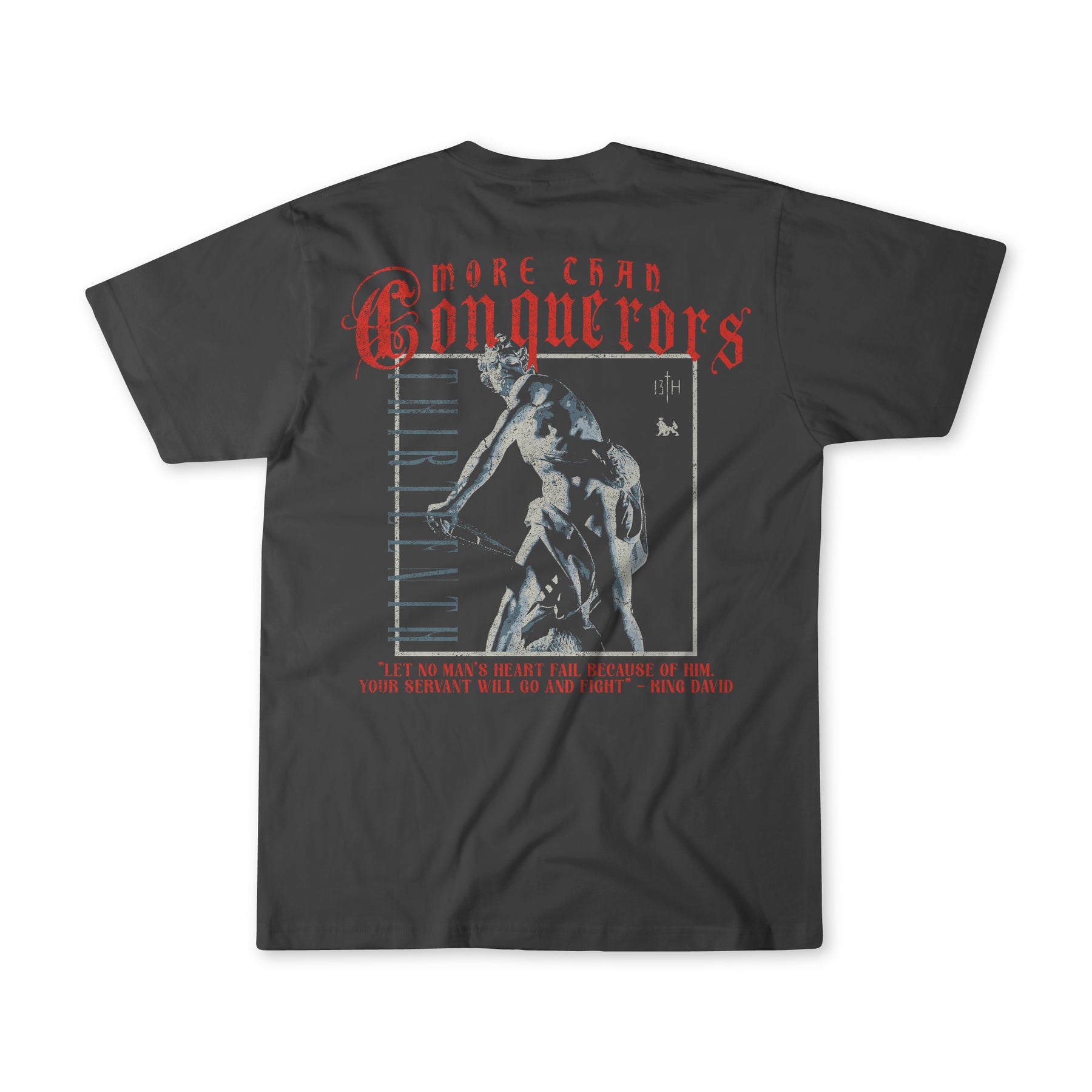 The Conquerors Premium Tee by 13th is a black T-shirt showcasing an artistic classical statue with red More than Conquerors text above. Below, King Davids quote No Mans Heart Fail inspires courage and strength.