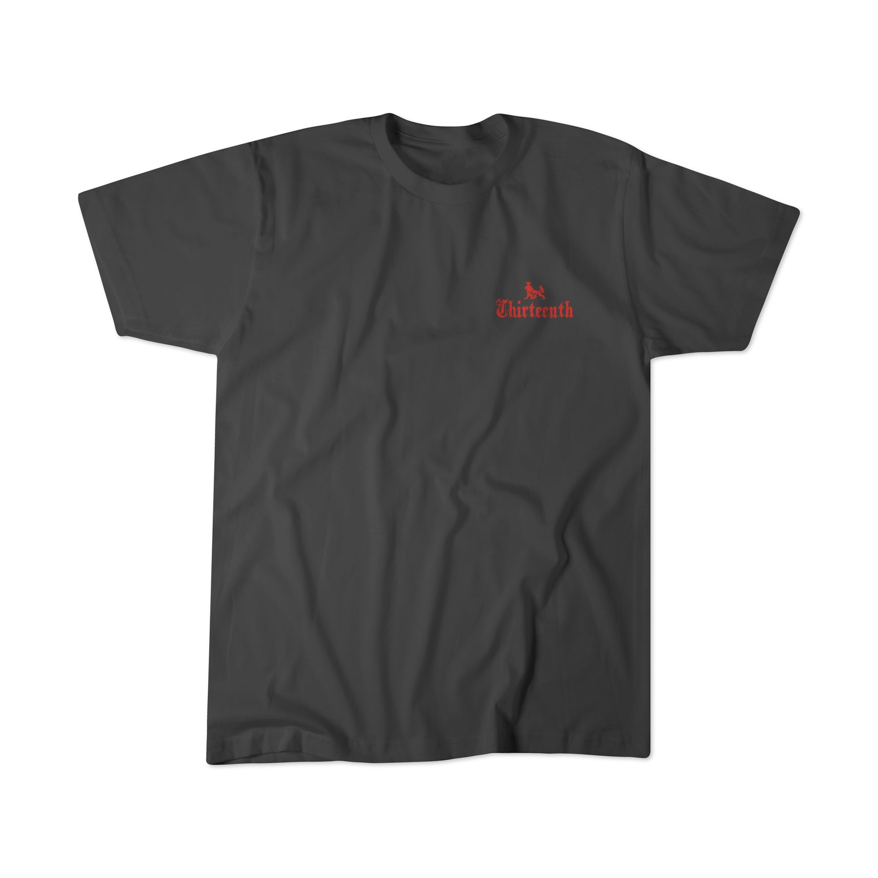 The Conquerors Premium Tee from 13th features Thirteenth in red gothic font with a rose-like symbol on the chest. It embodies the spirit of No Mans Heart Fail, symbolizing resilience and strength, set against a dark gray backdrop.