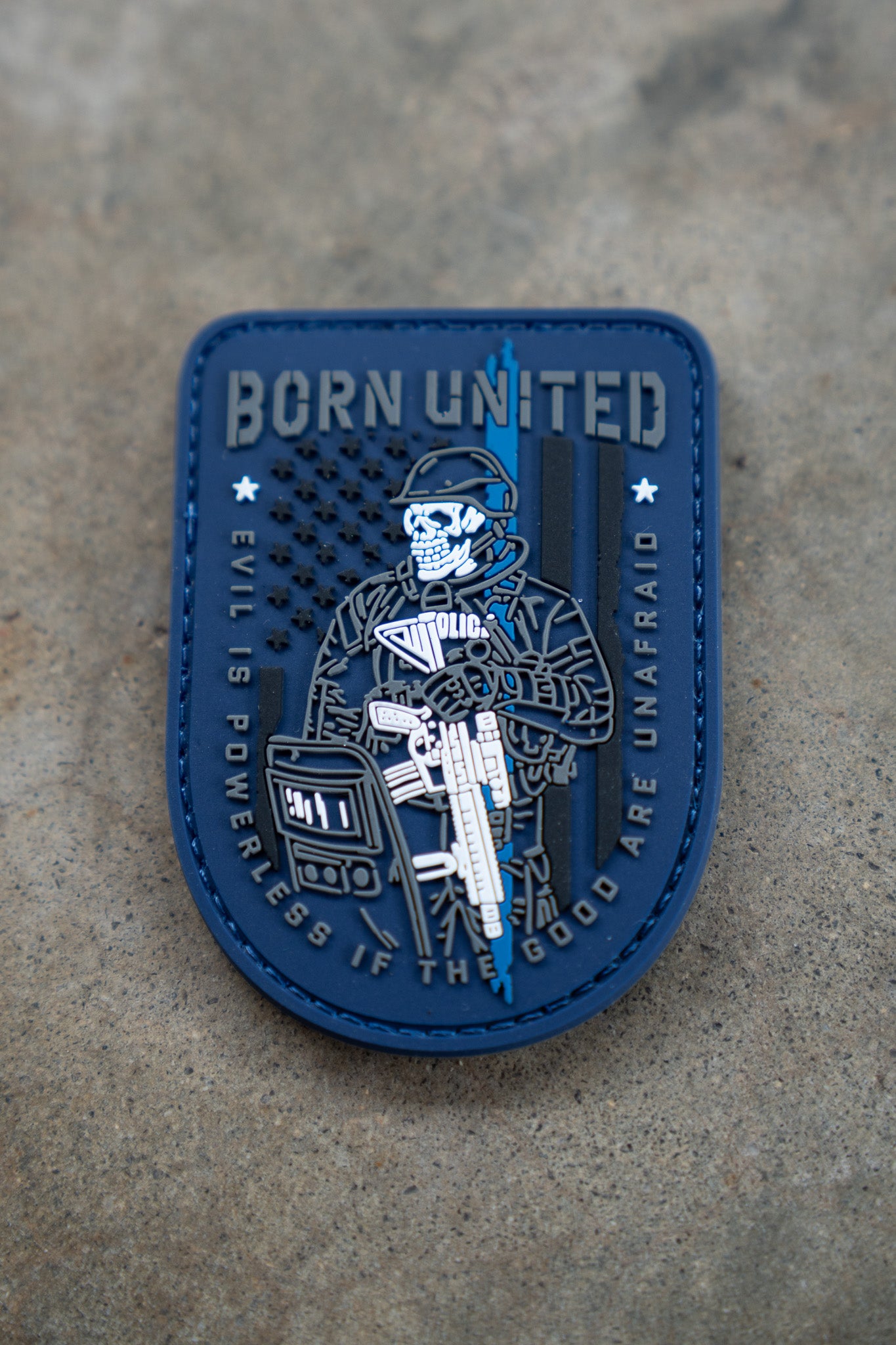 The Good Are Unafraid PVC Patch by Born United Private Label features a blue background, a skeleton in tactical gear holding a rifle, and a U.S. flag. Text reads: BORN UNITED and EVIL IS POWERLESS IF THE GOOD ARE UNAFRAID.