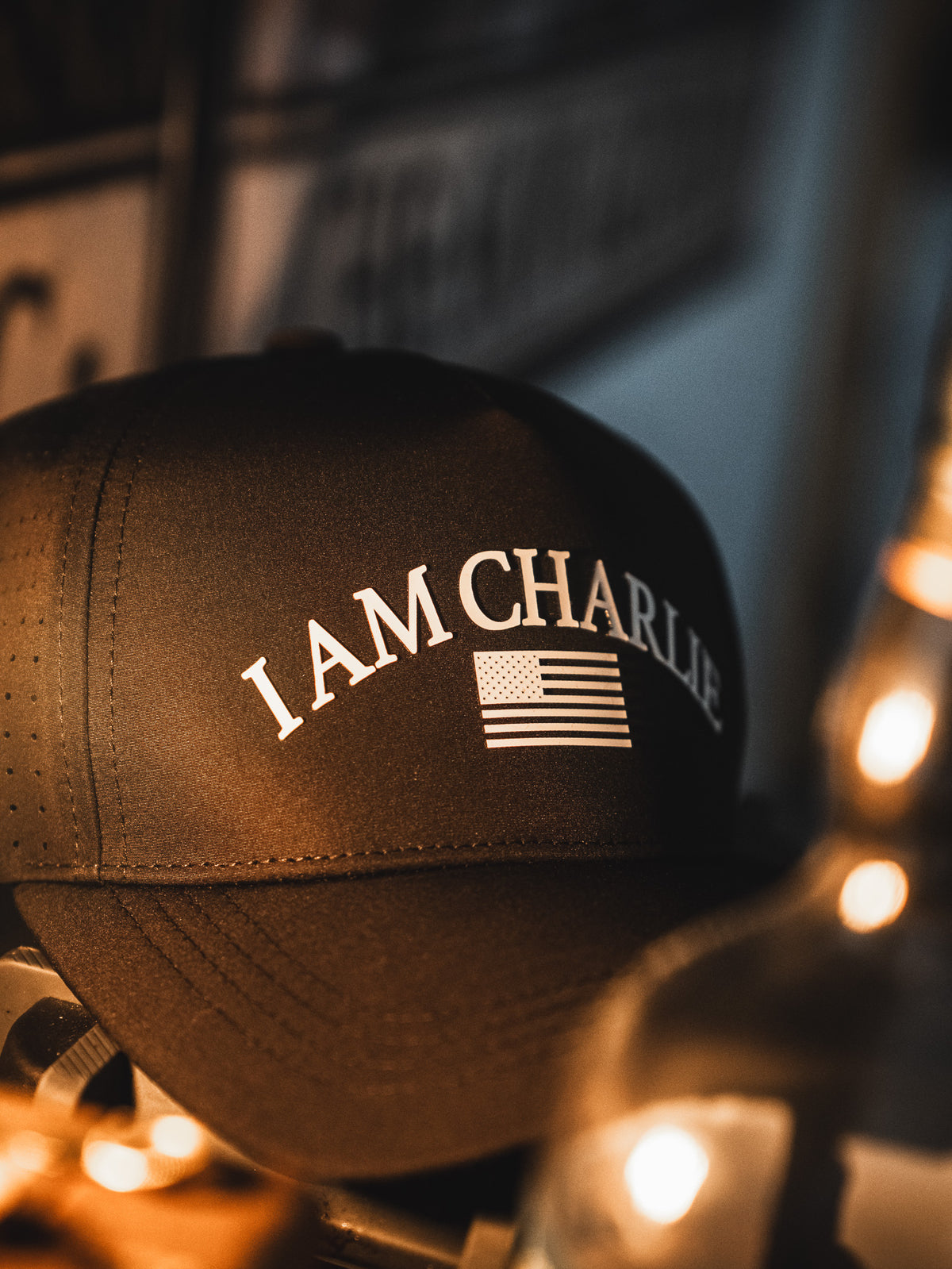 The I Am Charlie Black Snapback by Born United Private Label features "I AM CHARLIE" and an American flag on the front—a stylish choice for fans of handmade hats.