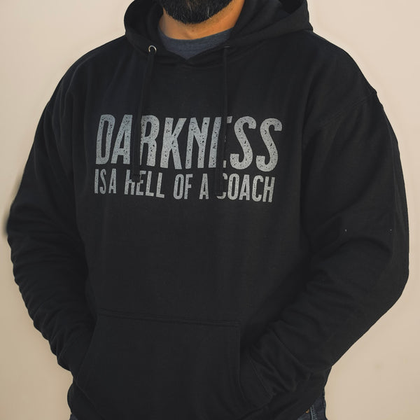 tango charlie - darkness is a hell of a coach hooded sweatshirt on model