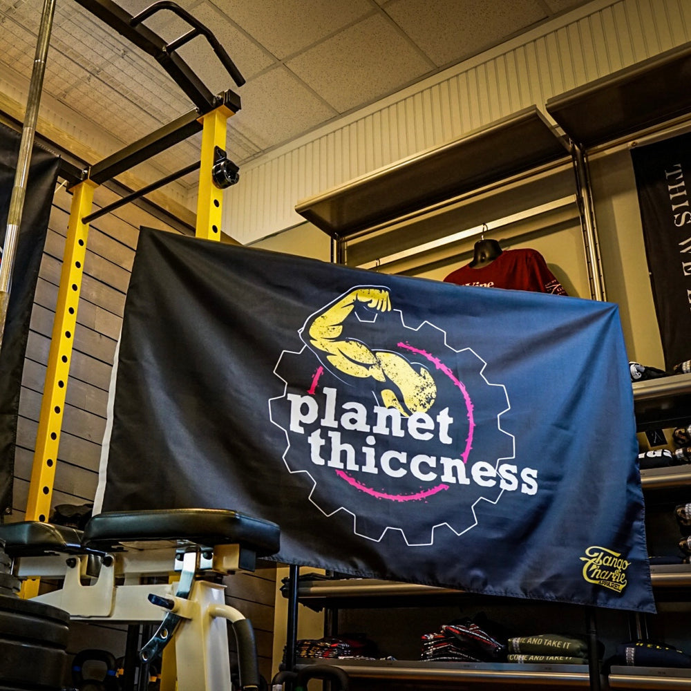 tango charlie - planet thiccness wall banner