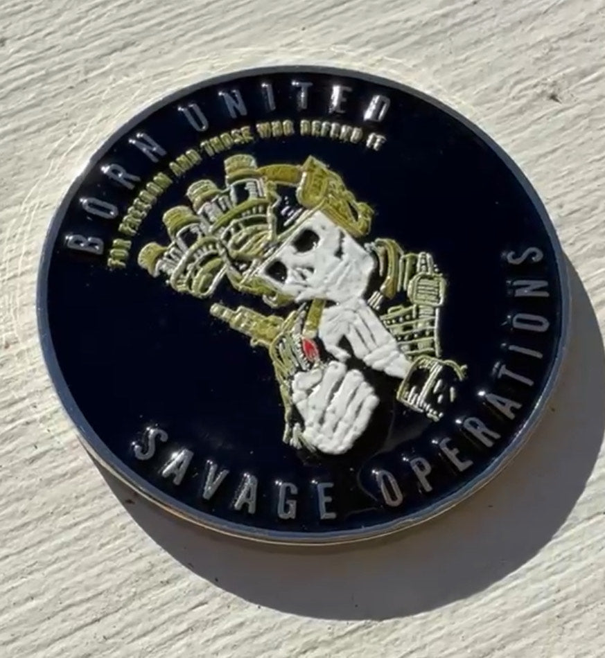 The Savage Operations Challenge Coin by Born United Private Label features a skeletal figure in military gear holding a smoking gun against a light background. The round metal coin displays BORN UNITED at the top and SAVAGE OPERATIONS below.