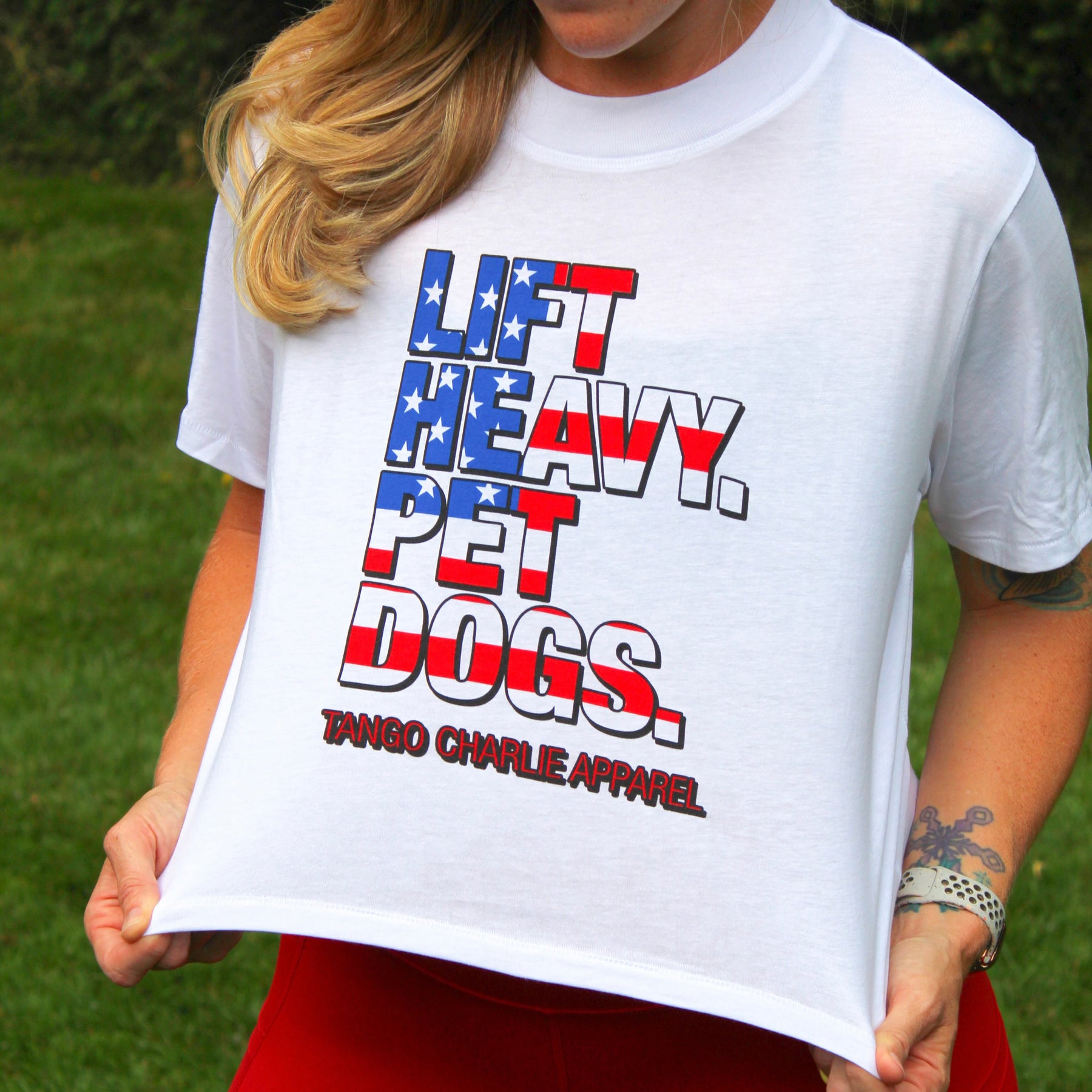 tango charlie - lift heavy pet dogs flag crop t-shirt on female model
