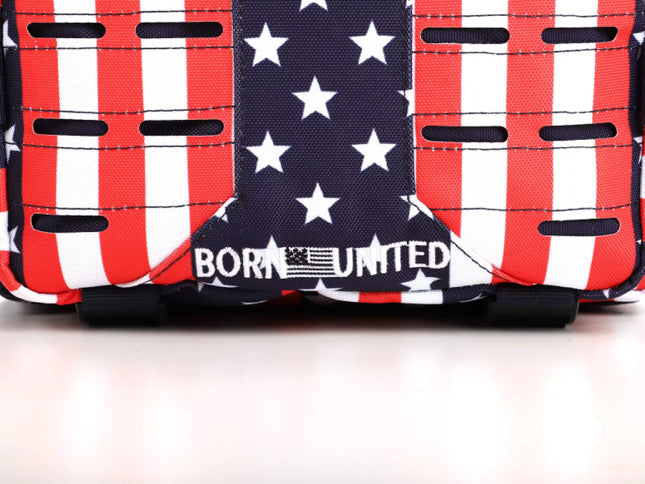 Close-up of the Ultimate Patriot Special Edition Tac-Pac - 25L by Born United Private Label, showcasing an American flag design with stars and stripes. The bold white BORN UNITED text is flanked by a small American flag graphic.