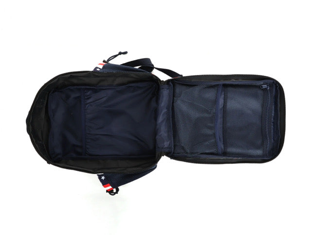 The Ultimate Patriot Special Edition Tac-Pac - 25L by Born United Private Label is shown flat, revealing a black exterior, main compartment, two mesh pockets, and dark blue interior with red, white, and blue accents on the straps.