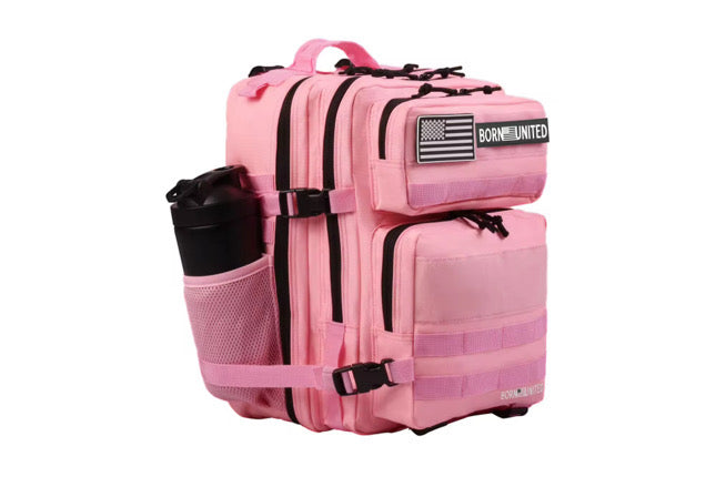 The Pink Mist Premium Tac-Pac - 25L by Born United Private Label features a pink tactical backpack with multiple zippered compartments, a side pocket containing a black bottle of Pink Mist, and an American flag patch with Born United.