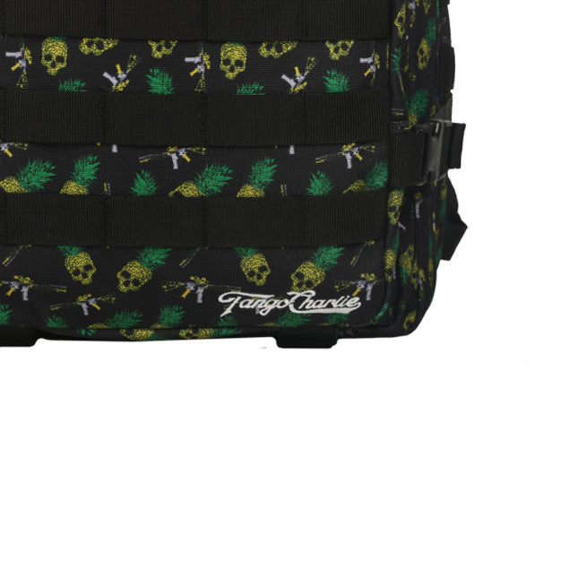 The TCA Tac-Pac - Tropic Thunder 2.0 by Tango Charlie Apparel is a 45L black backpack with yellow skull and pineapple patterns, offering tactical versatility. It features adjustable side straps for a customizable fit and Tango Charlie text in white on the bottom, perfect for style and functionality seekers.