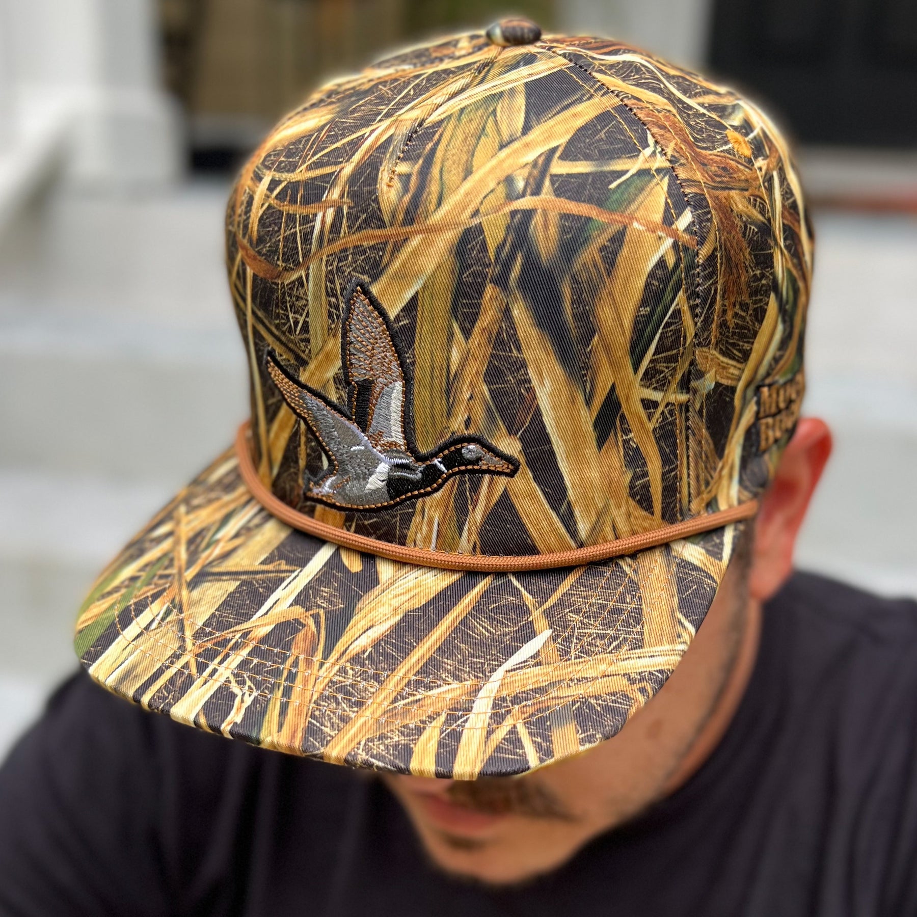 mucker bucket - straw grass camo duck hat on model
