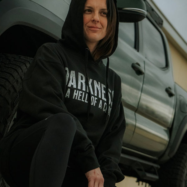 tango charlie - darkness is a hell of a coach hoodie on female model