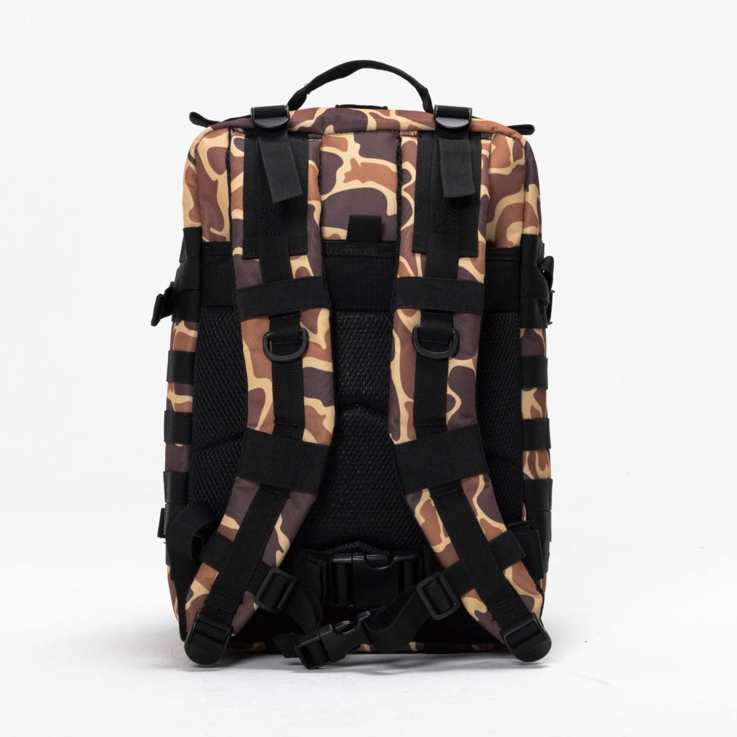 The Mucker Bucket Duck It Limited Edition Tac-Pac - 25L, a brown and tan camo-patterned backpack, is shown upright with padded shoulder straps, sternum strap, and black buckles facing forward against a plain white background.
