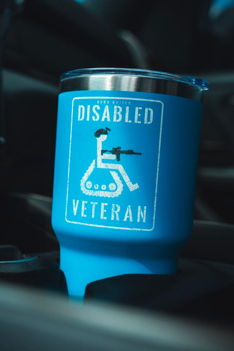 The Born United Private Label Disabled Veteran Tumbler - 30oz features “DISABLED VETERAN” with a wheelchair-tank graphic and fits most car cup holders—ideal for showing pride on the go.