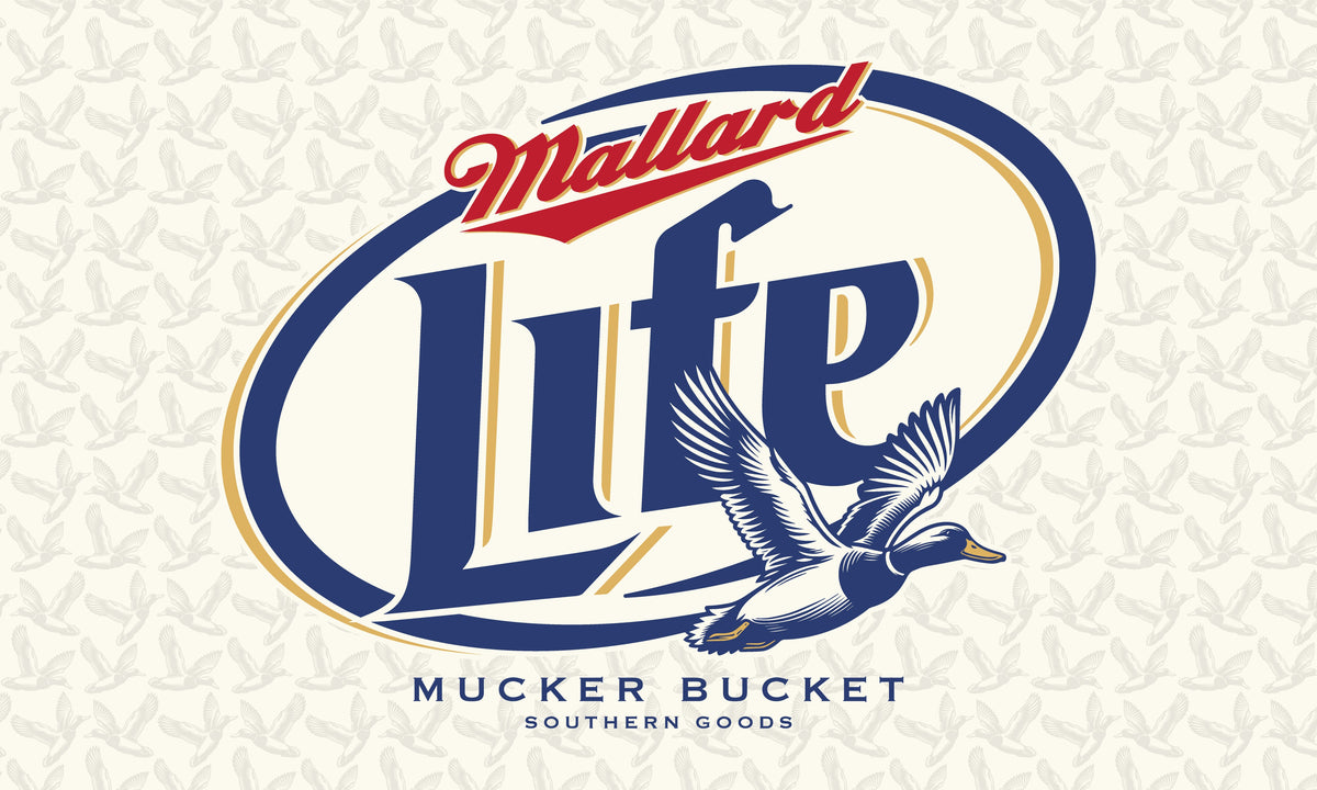 The Mallard Life Flag from Mucker Bucket showcases a stylized Mallard Life logo with a flying duck illustration. It features subtle duck patterns on durable polyester, in red, blue, and beige.