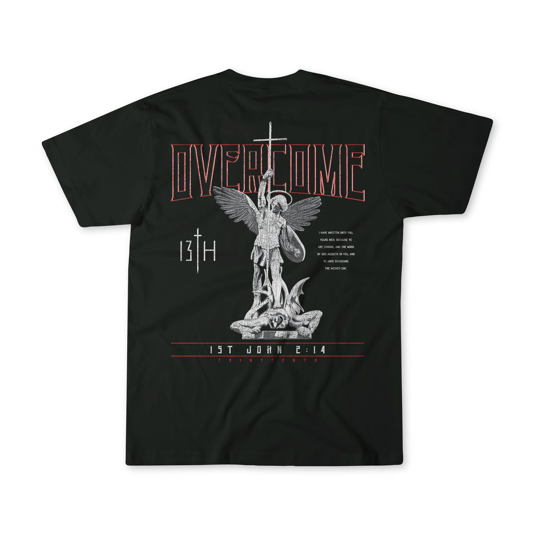 The Overcome Premium Tee by 13th is a black t-shirt with an angel wielding a sword over a creature, featuring the text OVERCOME and 1 John 4:14 to inspire young men with Gods word.
