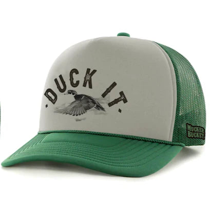 The Duck It Green Trucker Hat by Mucker Bucket features a gray front panel with a high-quality print of a flying duck and the words DUCK IT, plus a green mesh back and visor. A small label reads MUCK BUCKETS, making it ideal for duck hunting.
