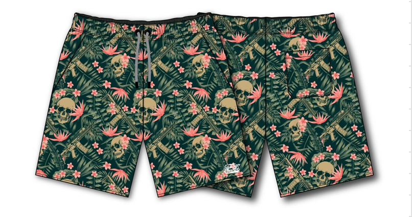 Tango Charlie Apparels Mens Performance Training Shorts, Aloha AR, feature a bold design with green leaves, pink flowers, and skulls. These 5.5 hybrids blend style and functionality for both casual beach days and intense workouts.