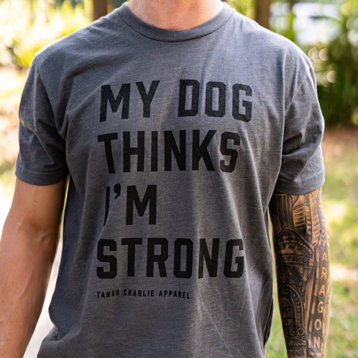 tango charlie - my dog thinks i'm strong tee shirt on model