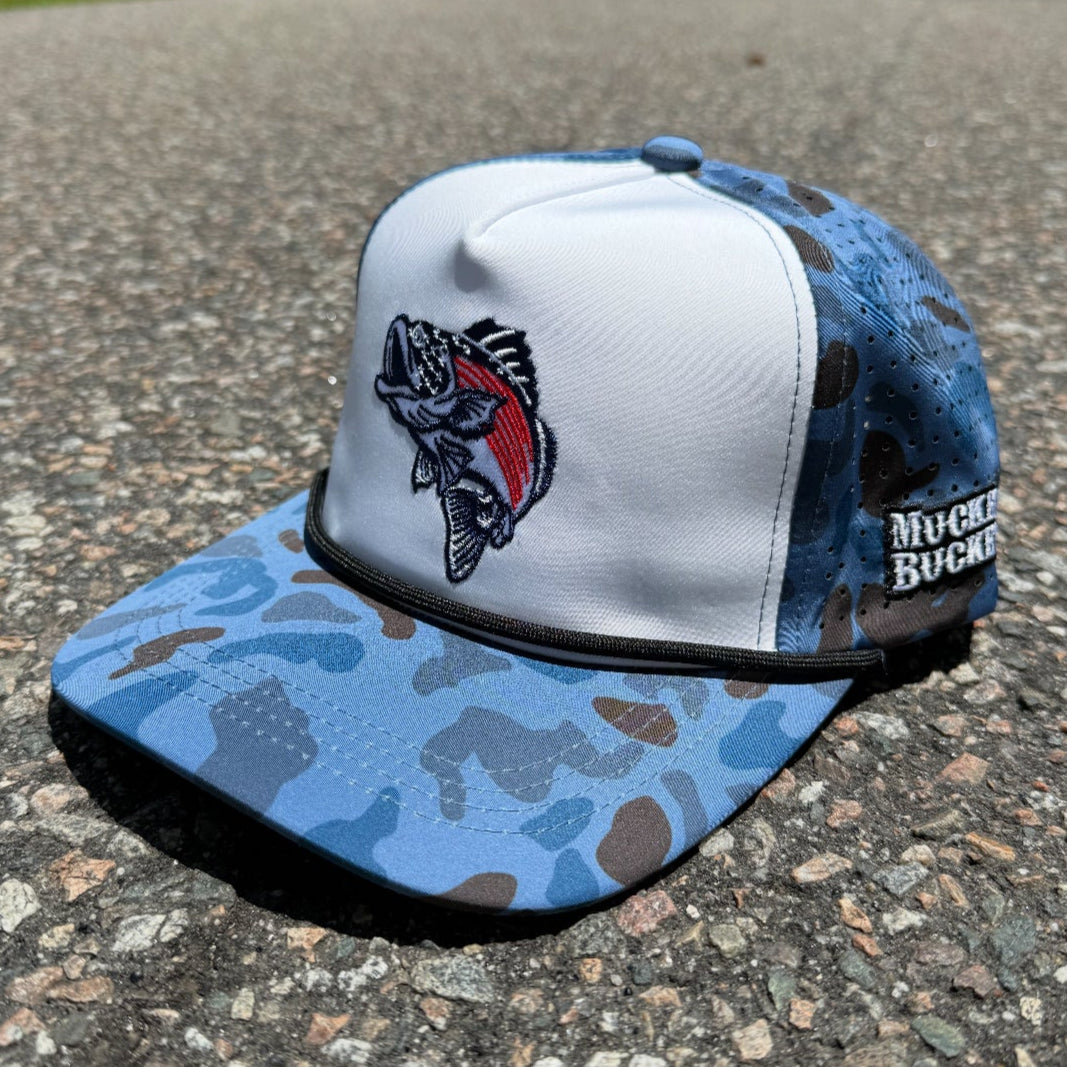 The Monster Bass Merica Water Camo Bucket by My Store is a blue and white trucker hat with a camo brim, mesh back, embroidered fish on the front, Muck Bucket patch on the side, and water-resistant snapback design.