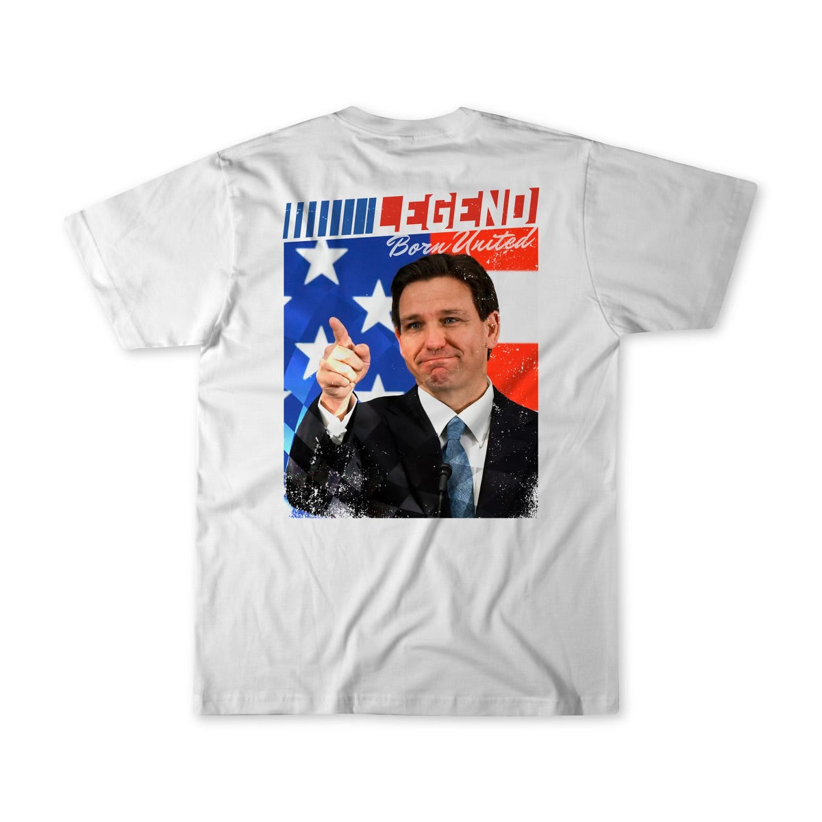 The Legend - DeSantis white T-shirt by Born United Private Label features a back graphic of a suited man pointing against an American flag backdrop, with LEGEND at the top and Born United below.