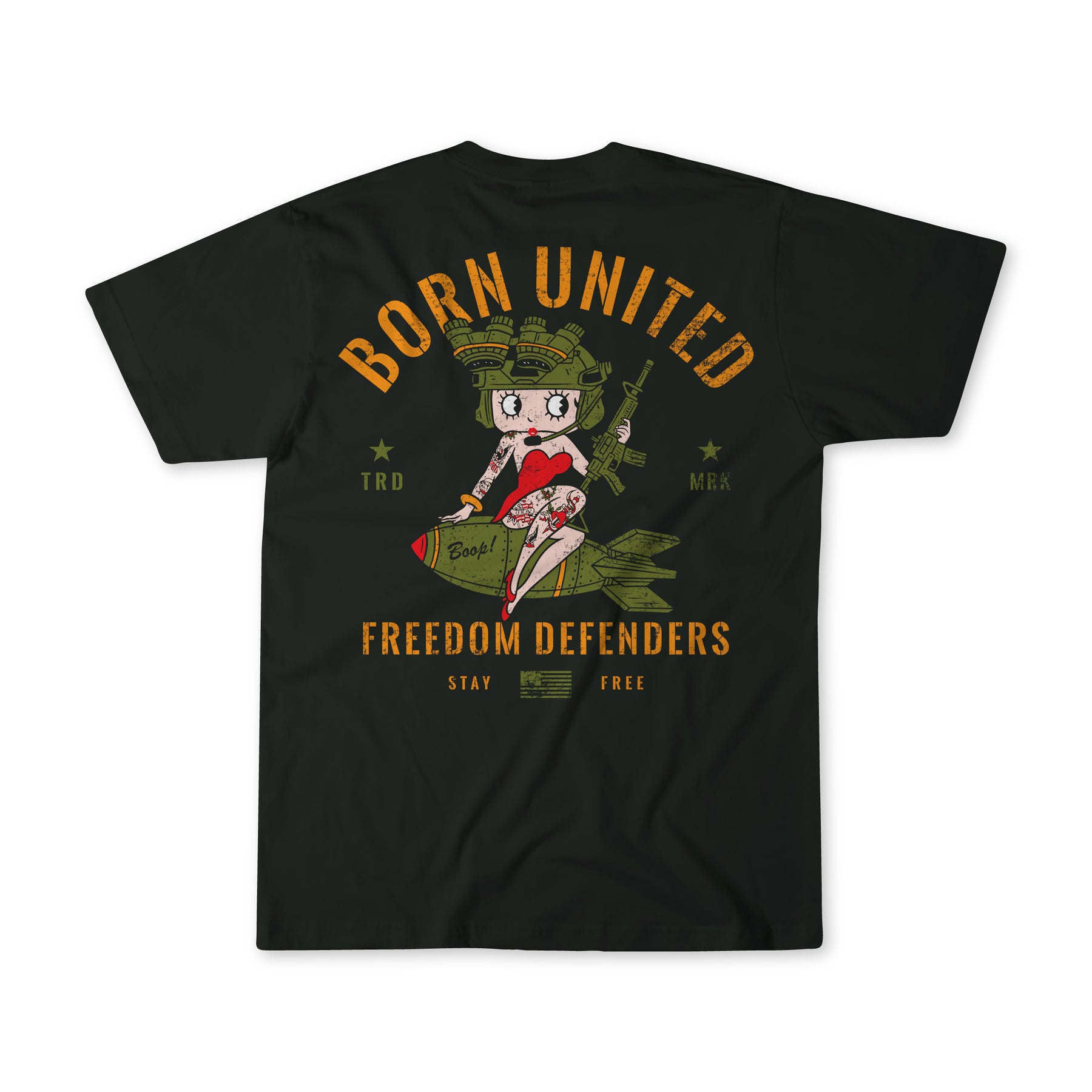 The Betty Boop Tee by Born United Private Label showcases a cartoon character in a helmet and red outfit on a bomb. The bold yellow text BORN UNITED - FREEDOM DEFENDERS - STAY FREE stands out on the dark background, featuring military-inspired graphics celebrating freedom defenders.