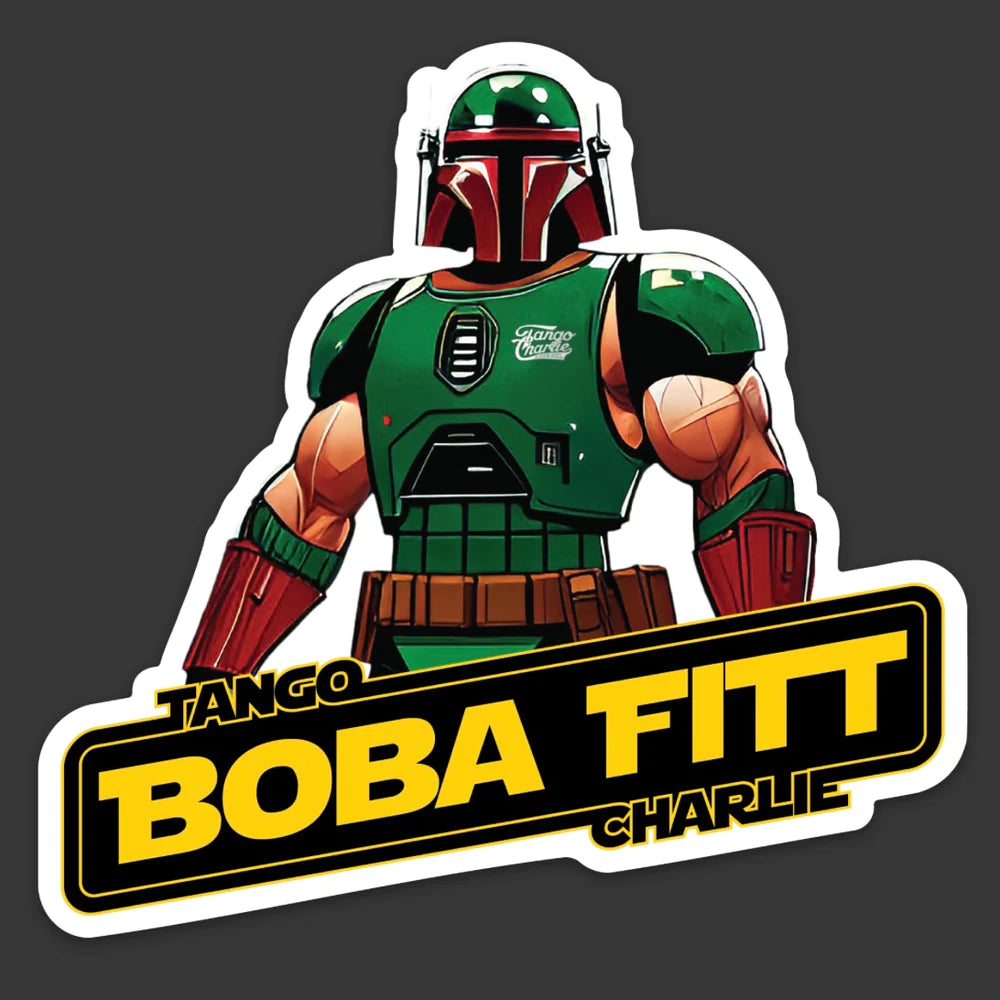 A muscular character in green and red armor, reminiscent of a futuristic soldier, embodies a fitness journey on the Boba Fitt Patch. The bold yellow and black text Tango Charlie Apparel stands out like a sticker against the dark background.