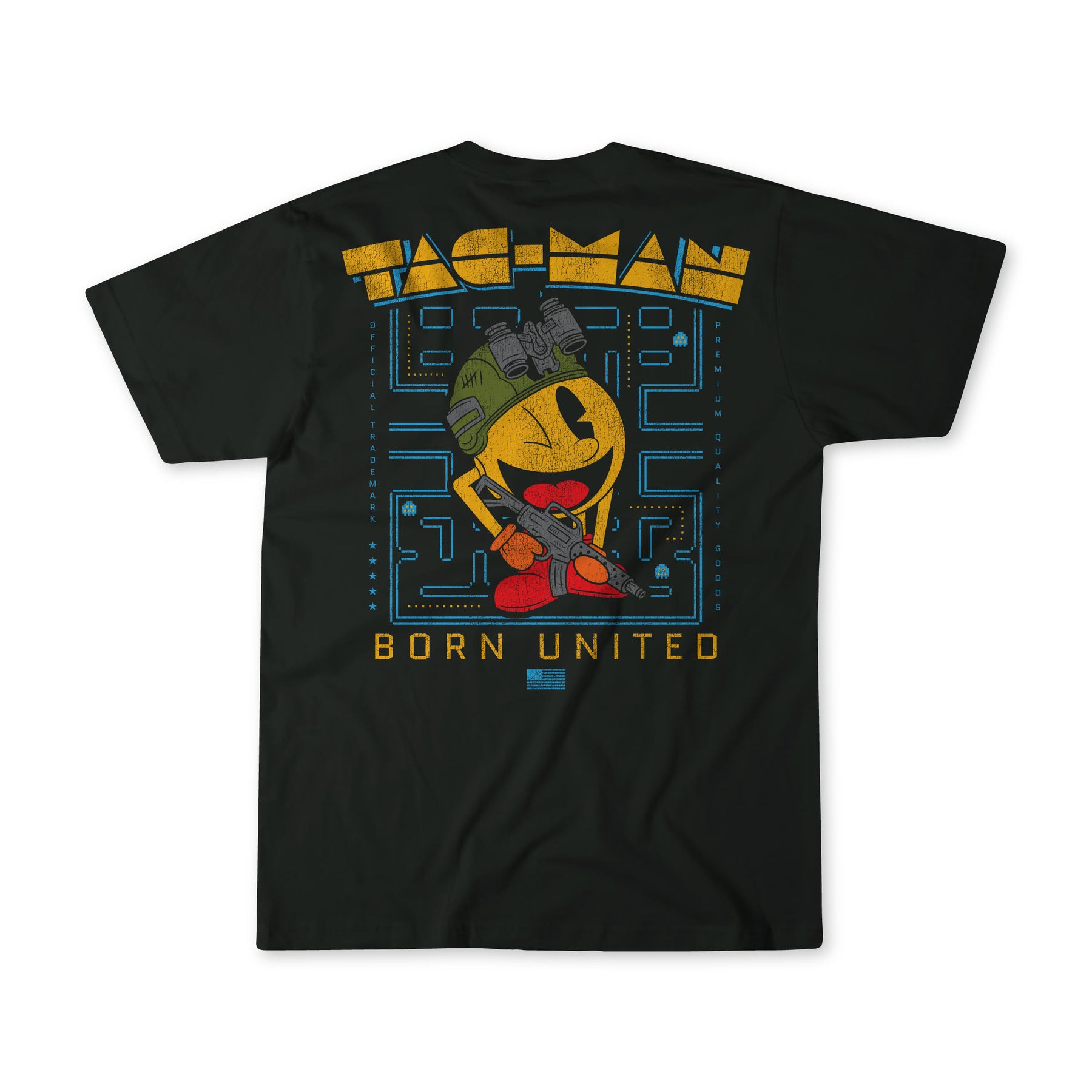The Tac-Man (Warehouse) black T-shirt by Born United Private Label features a design with a Pac-Man-inspired character in military gear and camo helmet, on a maze background, with PAC-MAN and BORN UNITED printed above and below.