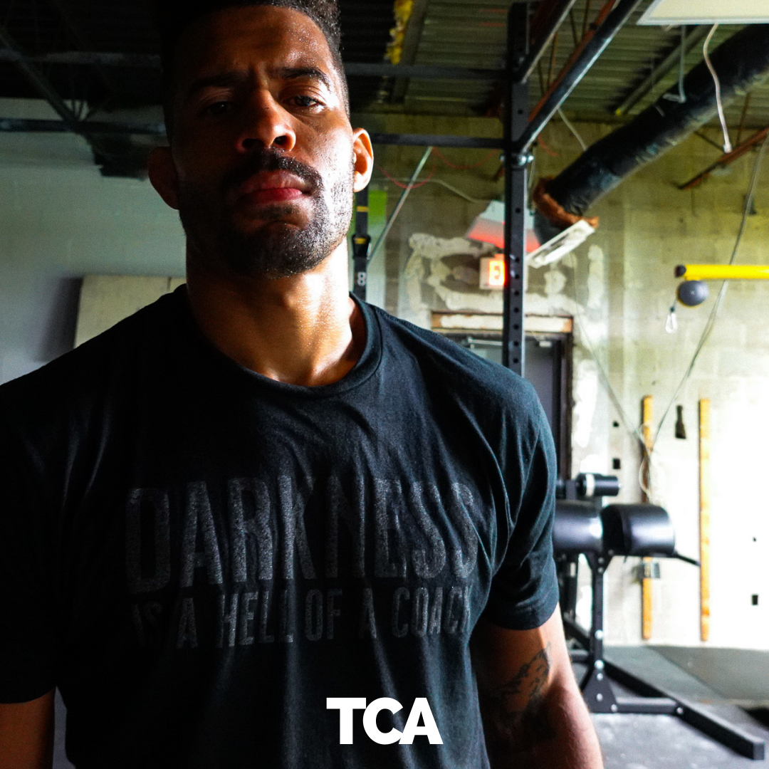 tango charlie - darkness is a hell of a coach t-shirt black on model