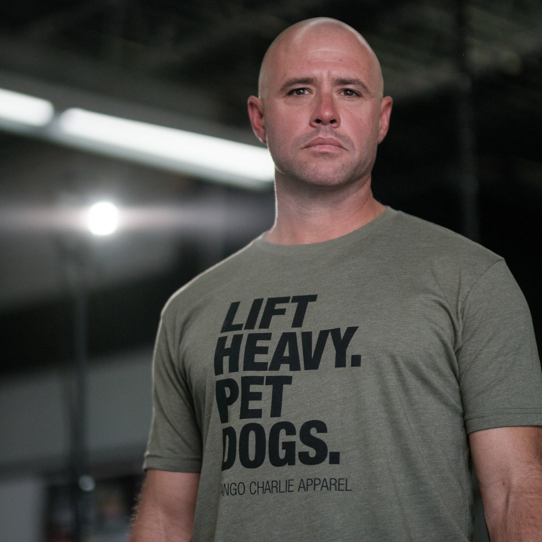 tango charlie - lift heavy pet dogs army green t-shirt on men's model