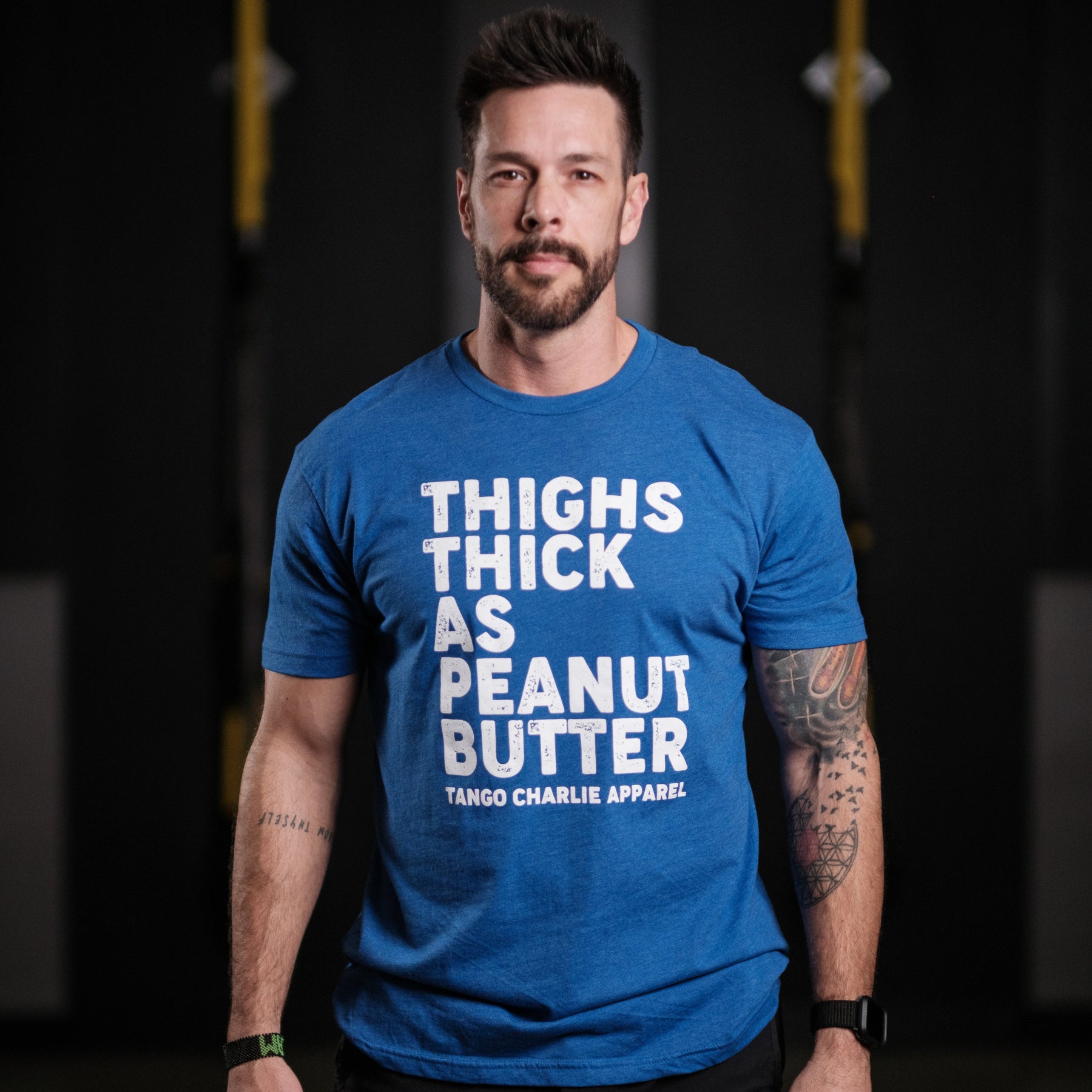 tango charlie - thighs thick as peanut butter t-shirt on model