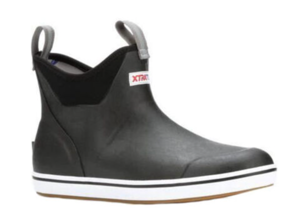 Discover the Xtratuf Mens 6 Ankle Deck Boot Black: stylish black ankle-high rubber footwear with a white sole featuring a sleek stripe. These waterproof boots have a back pull tab, slip-resistant design, top gray tab, and are adorned with a red and white front logo.