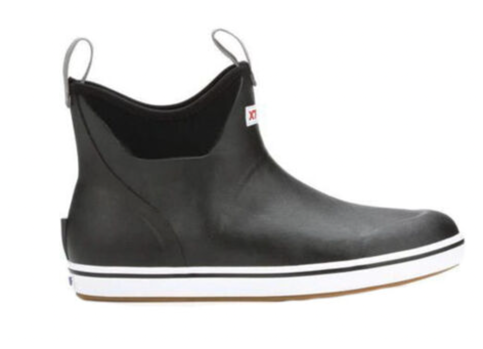 The Mens 6 inch Ankle Deck Boot by Xtratuf is a black waterproof boot with a white sole, two pull loops, and a red logo. Made with neoprene-like material around the ankle, these boots ensure slip-resistant traction.