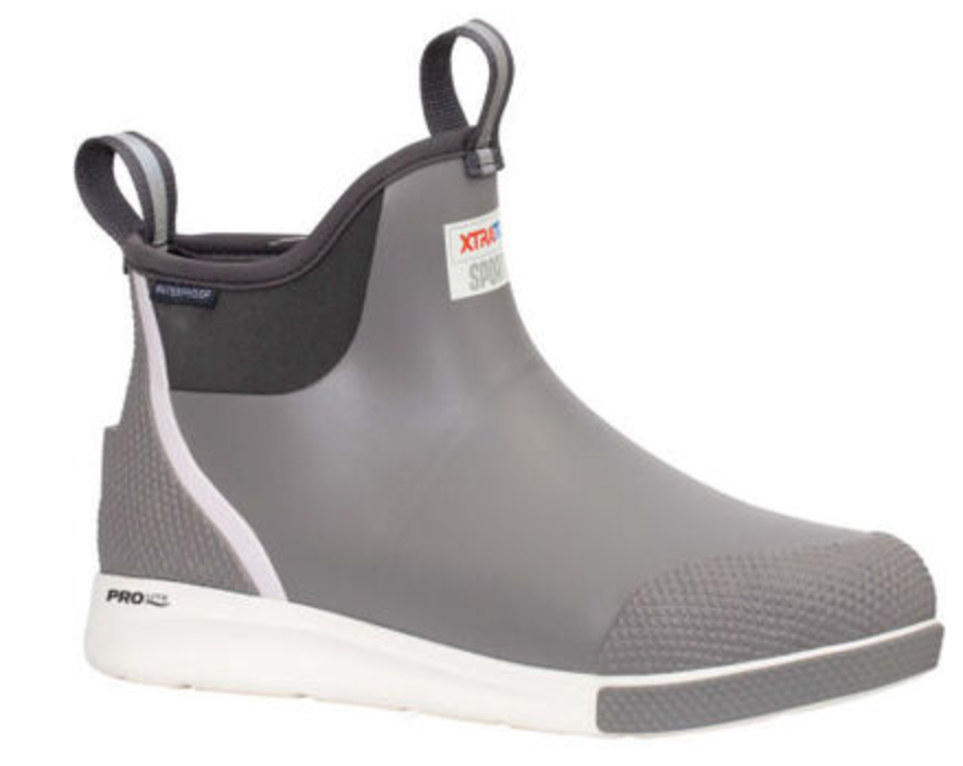 The Xtratuf Mens Ankle Deck Sport is a gray waterproof boot with black and white accents. It features pull loops, a slip-resistant outsole, and offers durability and comfort for sportfishing and outdoor activities.