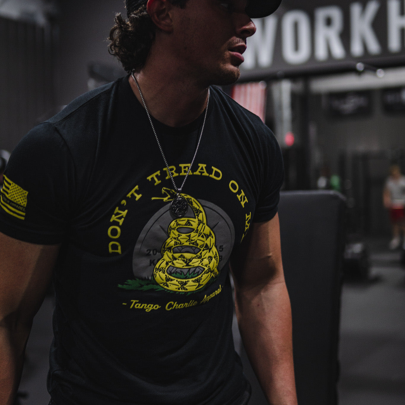 tango charlie - unisex gadsden flag t-shirt on model