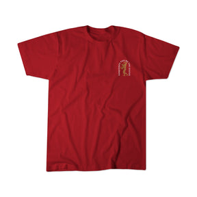 The St. Arnold The Stoic tee by Tango Charlie Apparel is a red short-sleeve shirt with a small left chest graphic featuring a yellow ribbon and curved text. The rest of this motivational t-shirt remains plain for a clean look.