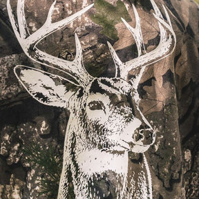 The Rut Realtree Premium Hoodie featuring a white graphic of a buck’s head with antlers printed on Realtree camo fabric.
