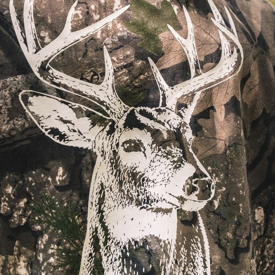 The Rut Realtree Premium Hoodie featuring a white graphic of a buck’s head with antlers printed on Realtree camo fabric.