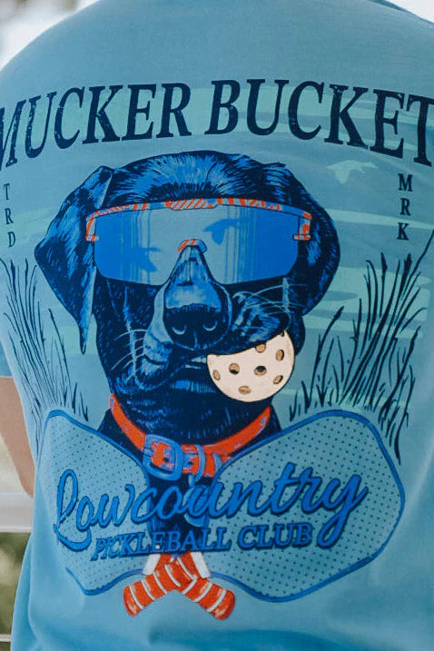 Light blue t-shirt with a graphic of a dog wearing goggles and text on the back.