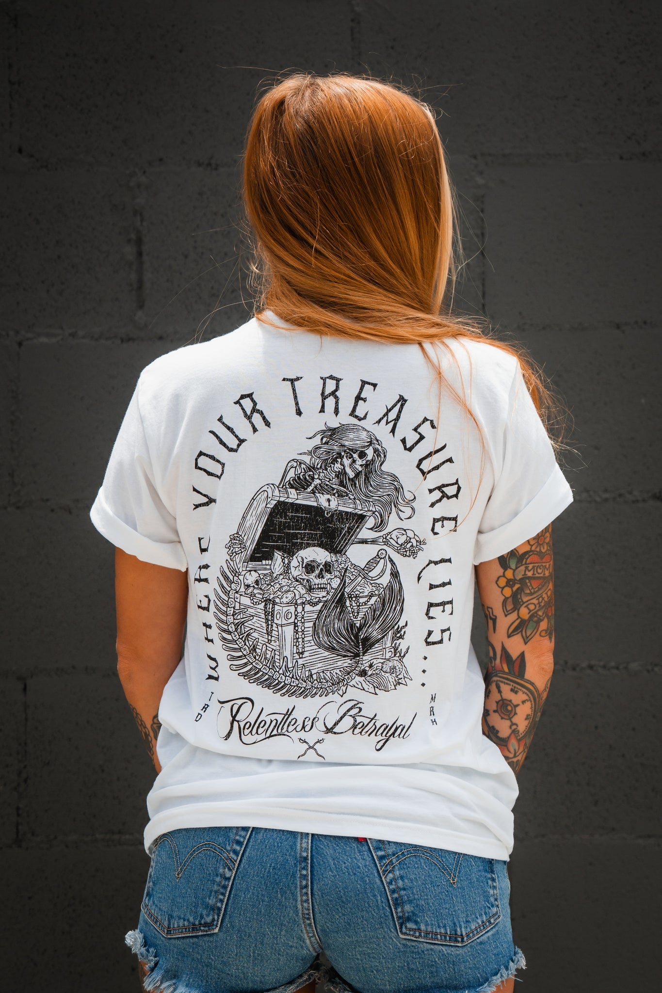 relentless betrayal - treasure tee on women's model