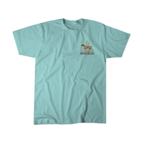 The Mucker Bucket Youth Dog DNA Premium Tee is a light blue kids’ t-shirt featuring a small dog graphic and the words “MUCKER BUCKET” on the left chest. This premium tee is shown laid flat on a white background.