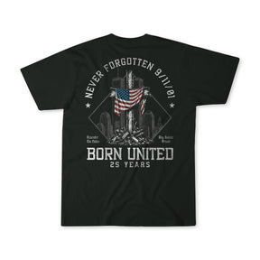 A black short-sleeve t-shirt shown from the back, featuring a distressed white graphic print of a rocket launching from the Statue of Liberty with an American flag, surrounded by the text 'NEVER FORGOTTEN 9/11/21' and 'BORN UNITED 25 YEARS'.