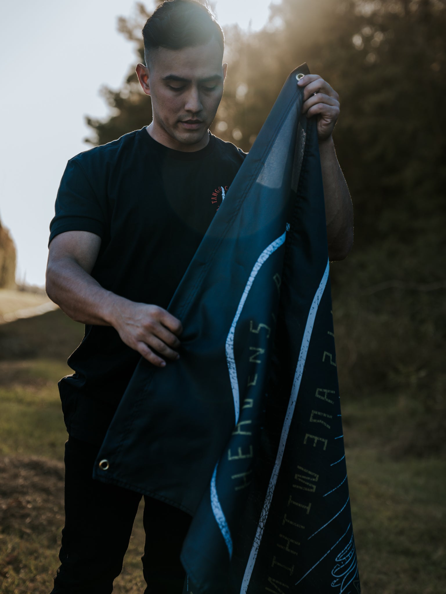 born united - heavens and hells banner hung by model