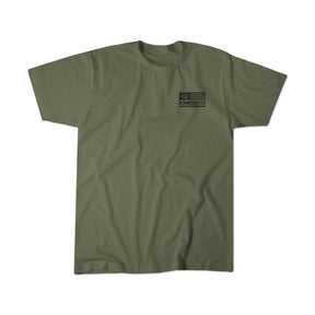 Olive green Next Level CVC short-sleeve shirt by Tango Charlie Apparel. Made from soft polyester and combed ringspun cotton, it features a small black American flag and Lift Heavy. Shoot Guns. on the left chest, laid flat on white.